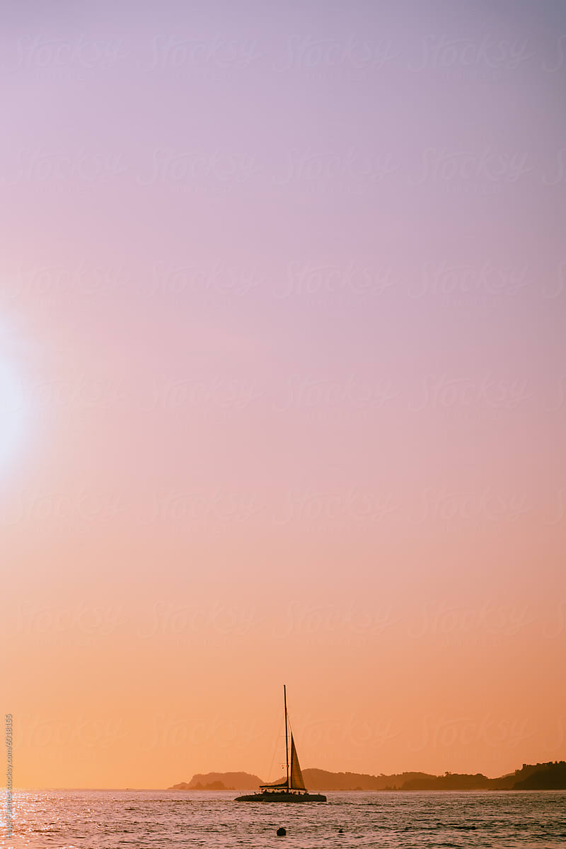 Sailboat silhouette during sunset at Mexico.