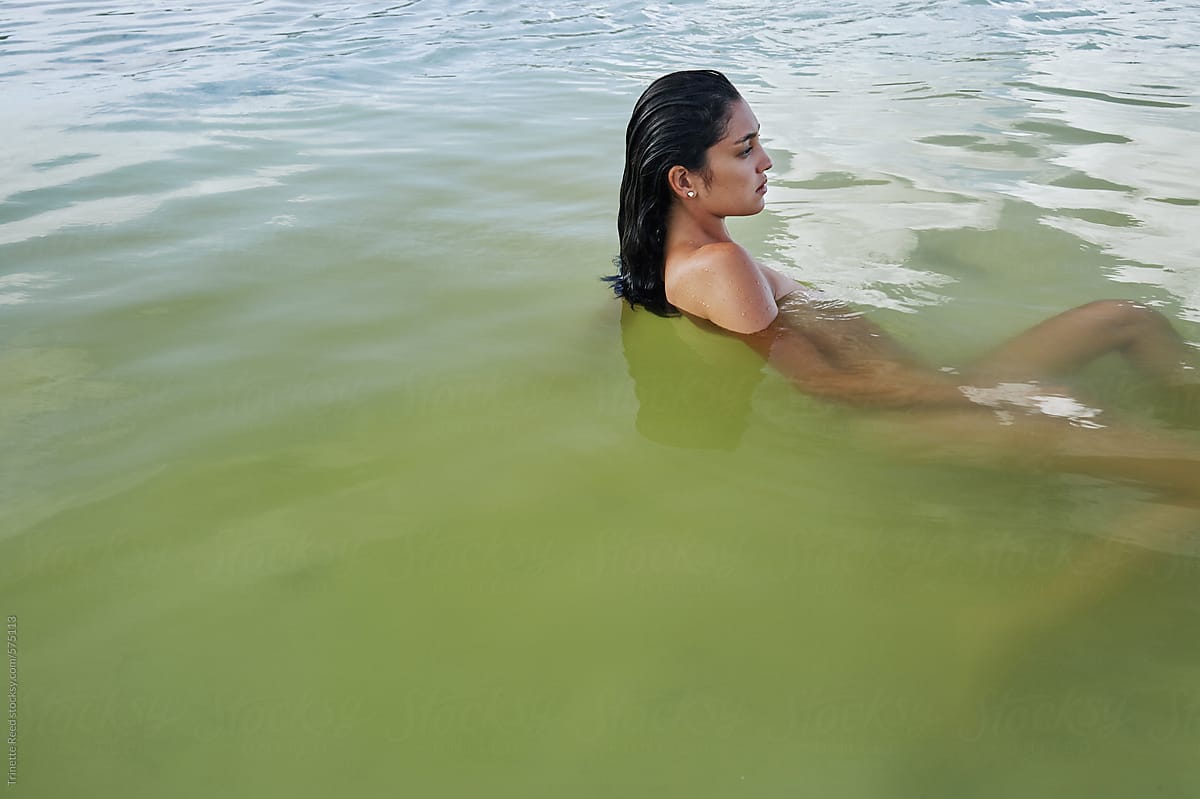 Woman floating in ocean water