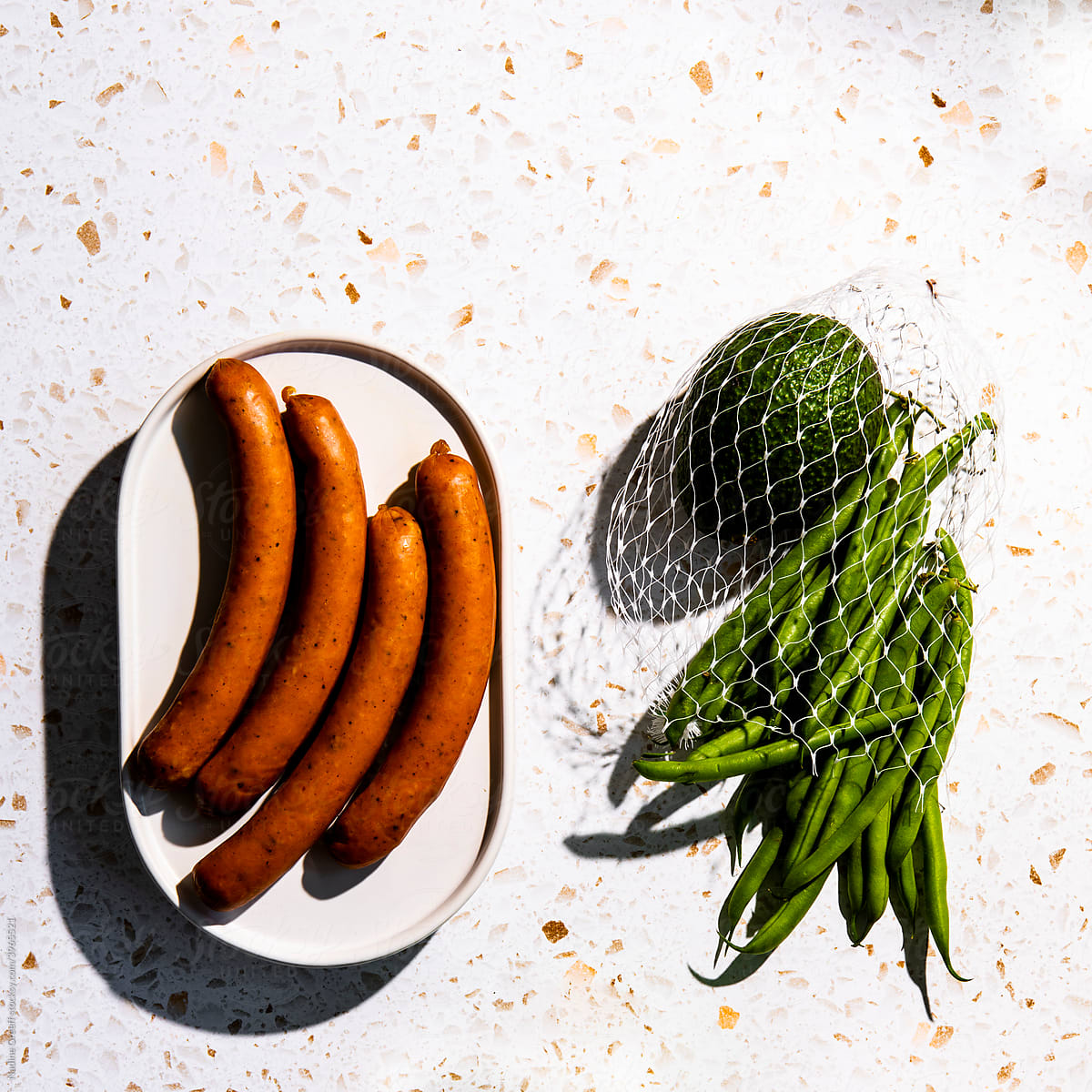 Food on table, sausage and green vegetables
