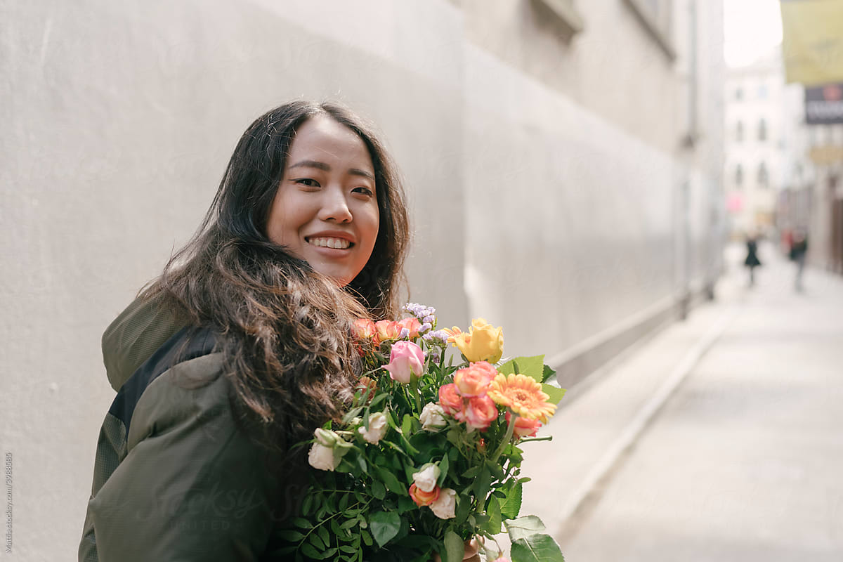 Korean Young woman on the street with flowers