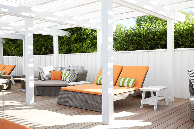 Lounge furniture at pool at luxury resort