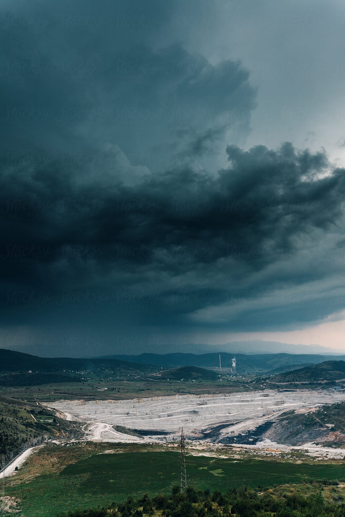 Storm clouds above coal mine