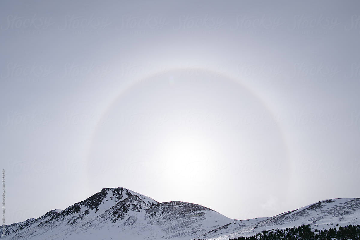 Ring around the sun in snowy landscape