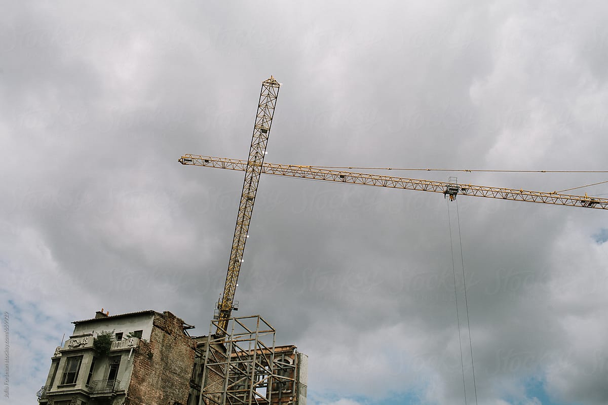 Cranes against gloomy sky