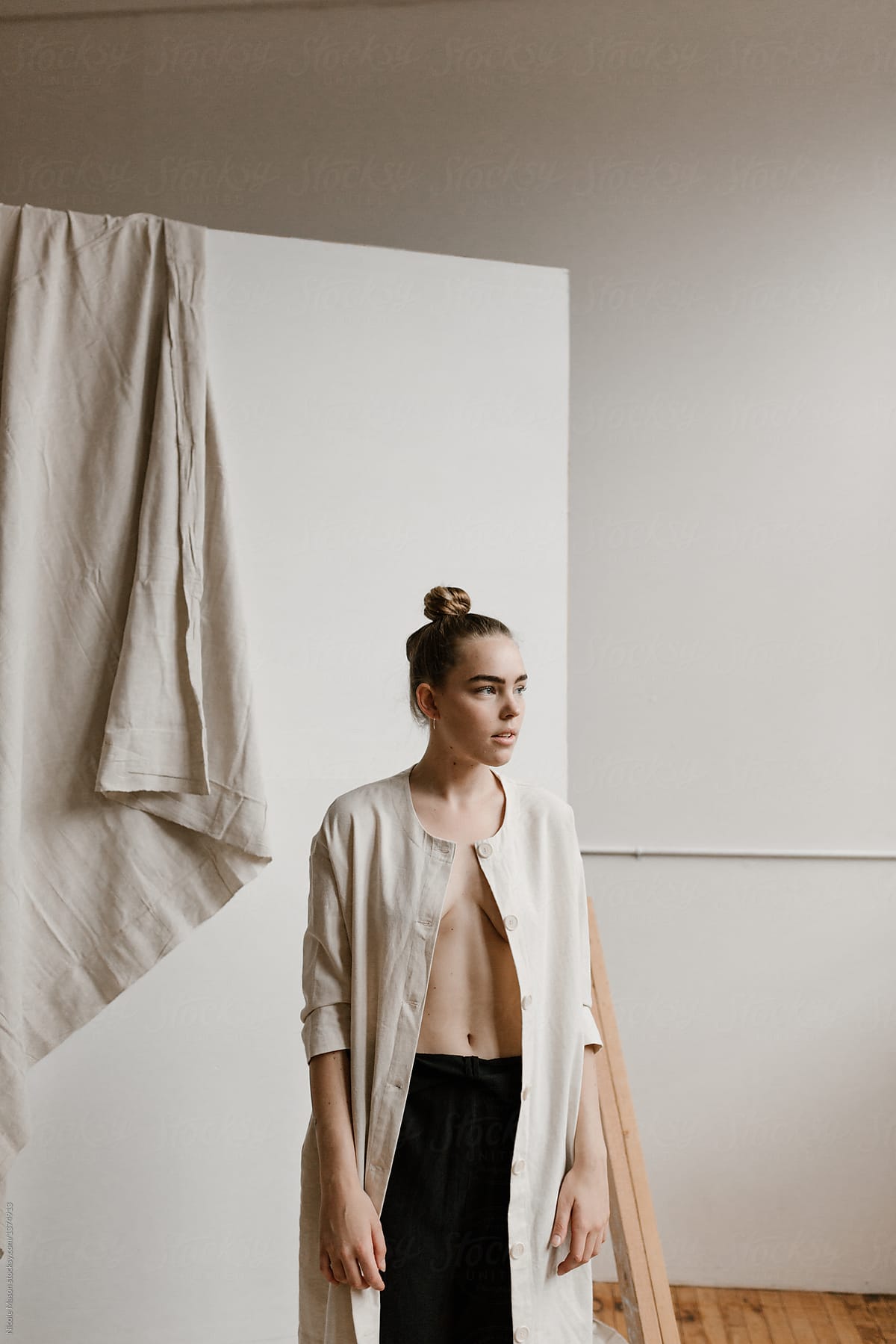 Woman Wearing Open Light Jacket With Nothing Underneath by Stocksy  Contributor Nicole Mason - Stocksy