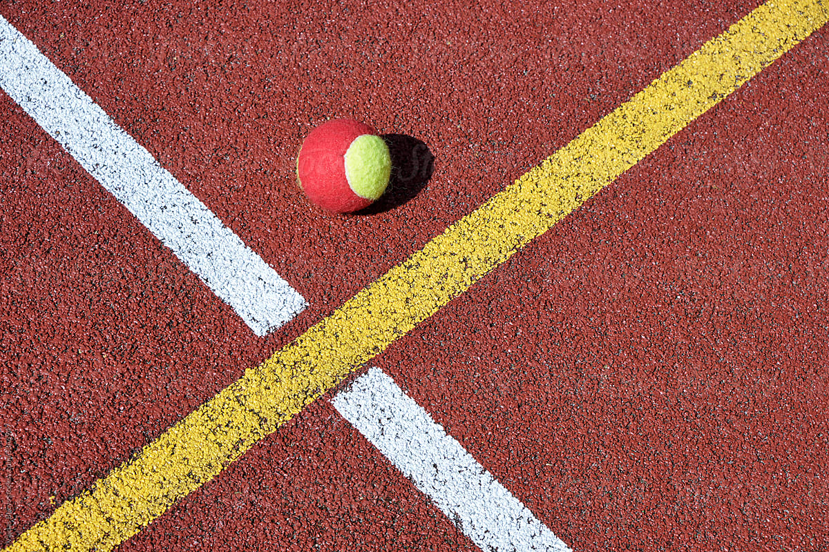 Tennis ball and geometric court lines