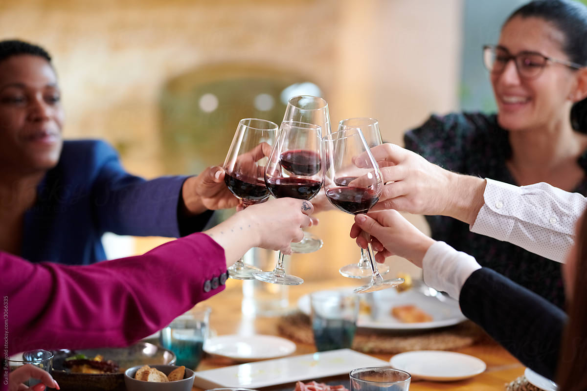 Business people toasting with wine glasses
