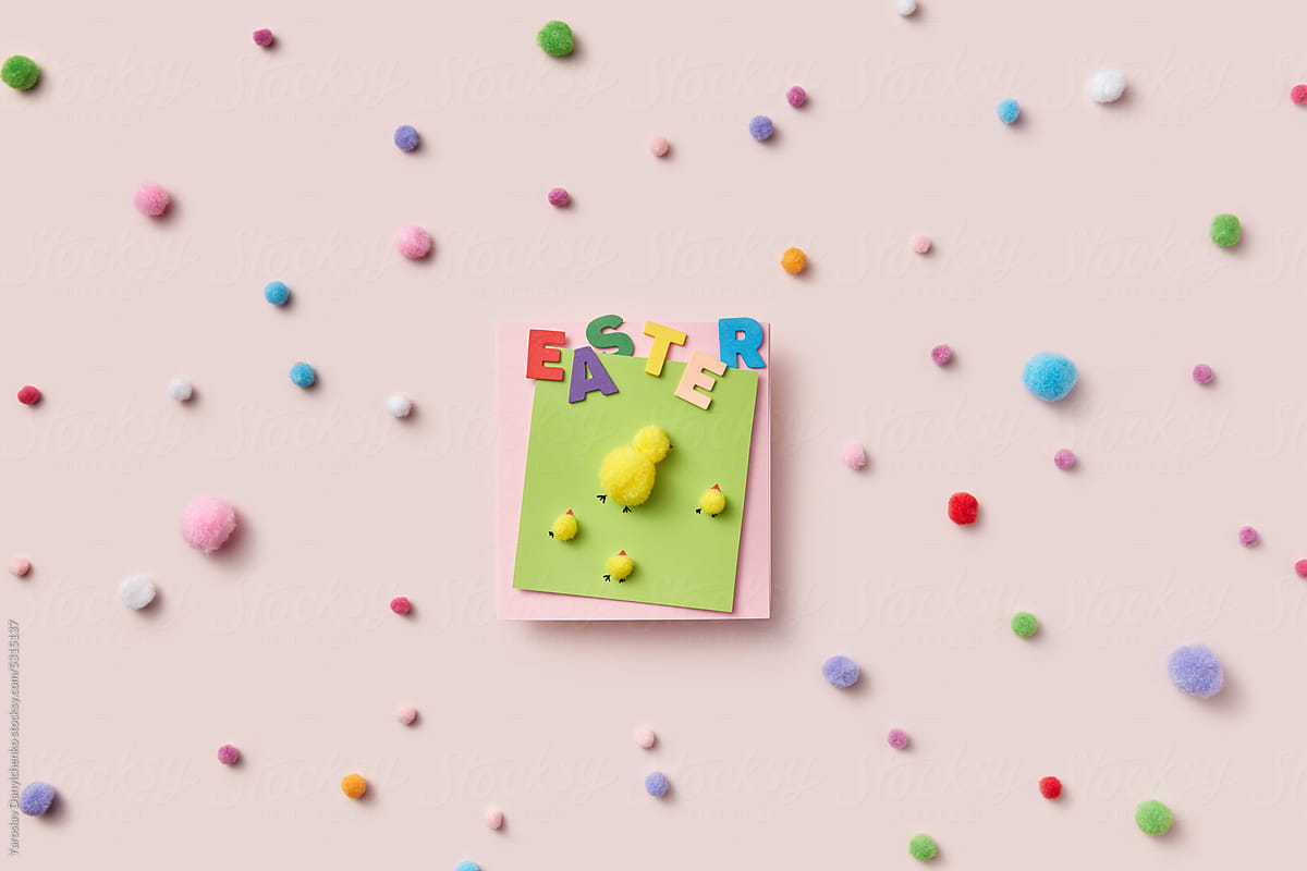 Bright Easter greeting card with fluffy balls.