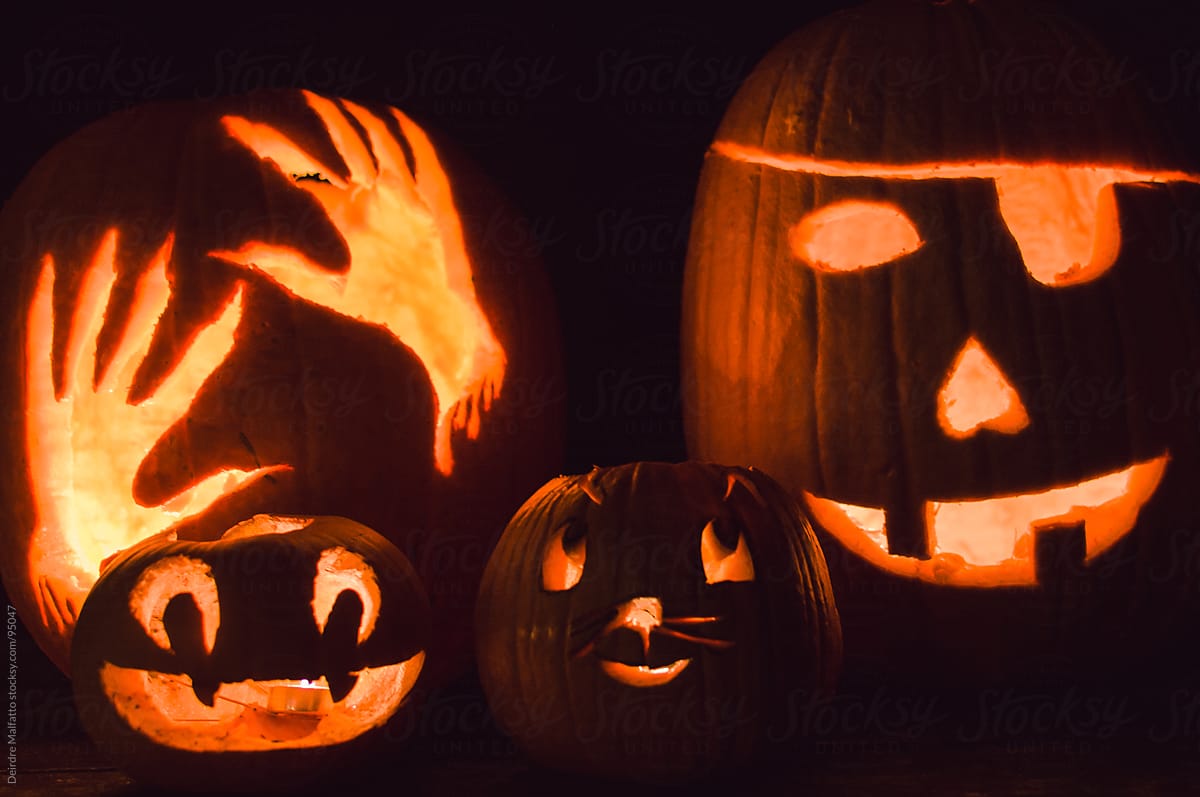 carved pumpkins (jack-o-lanterns) by candlelight on halloween