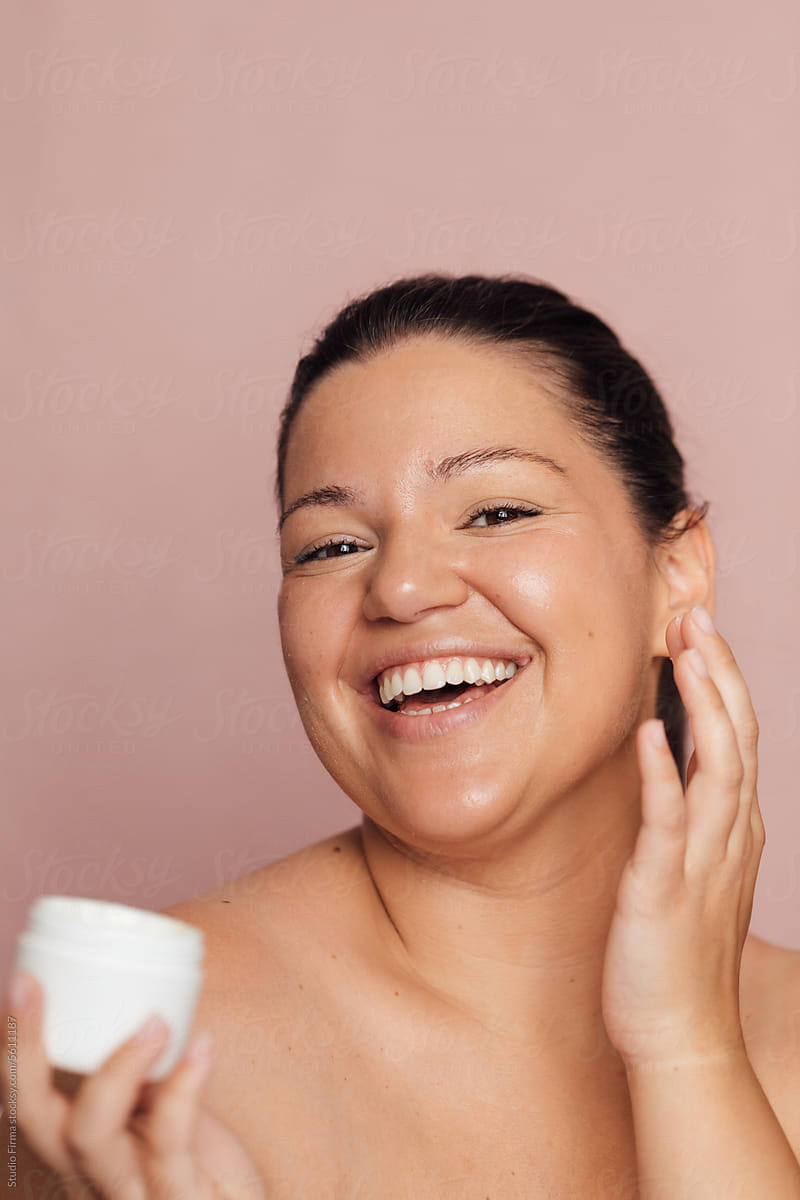 Woman Applying Cosmetic Product