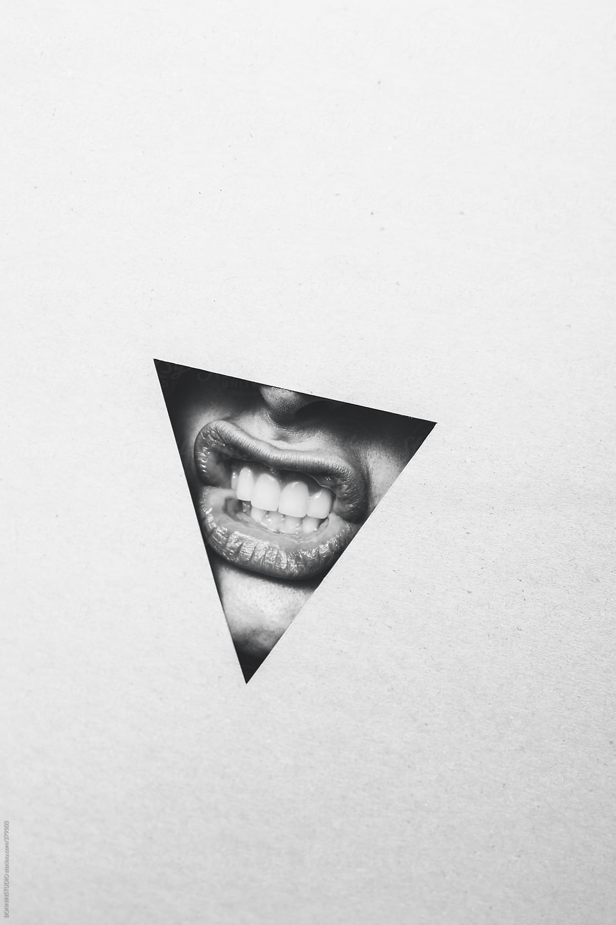 Mouth and teeth. Body part in a triangle.