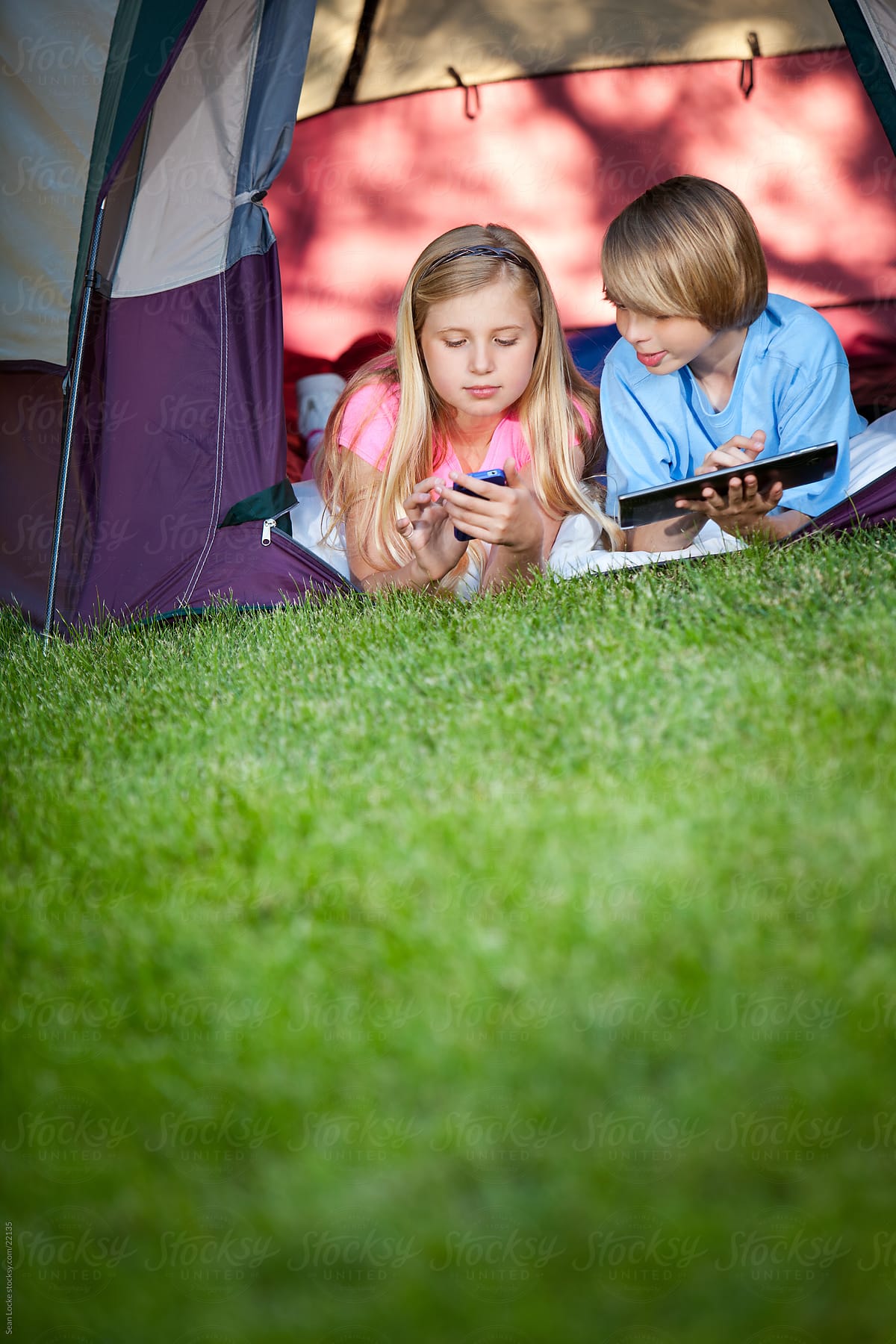 Camping: Kids Using Technology in Tent