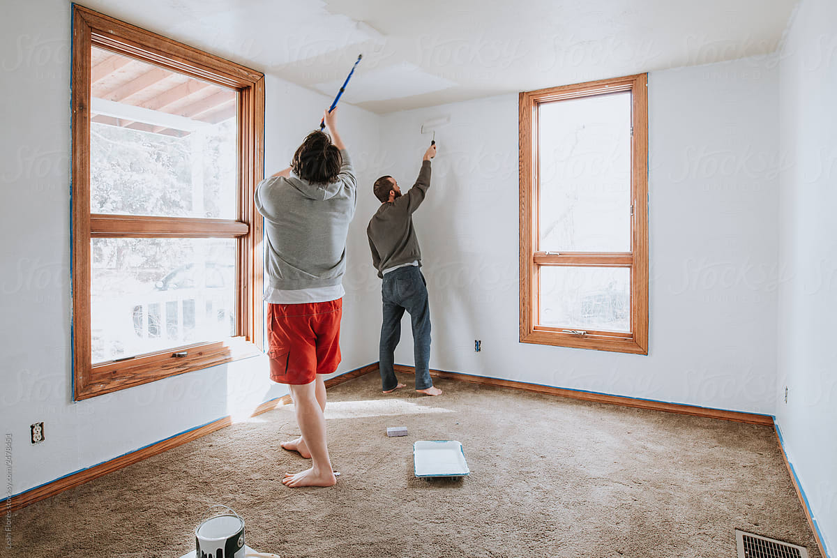 Two Men Painting Living Room