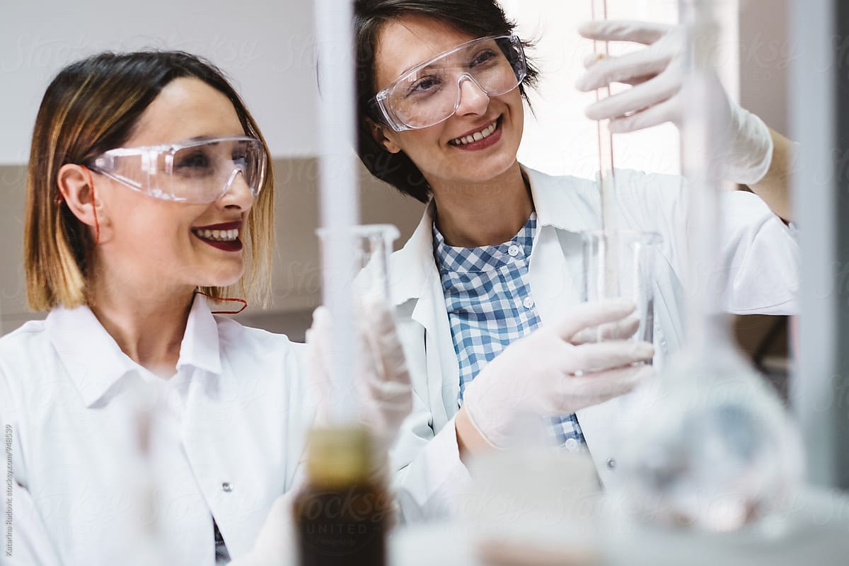 Two Female Chemist Scientists Working in the Lab