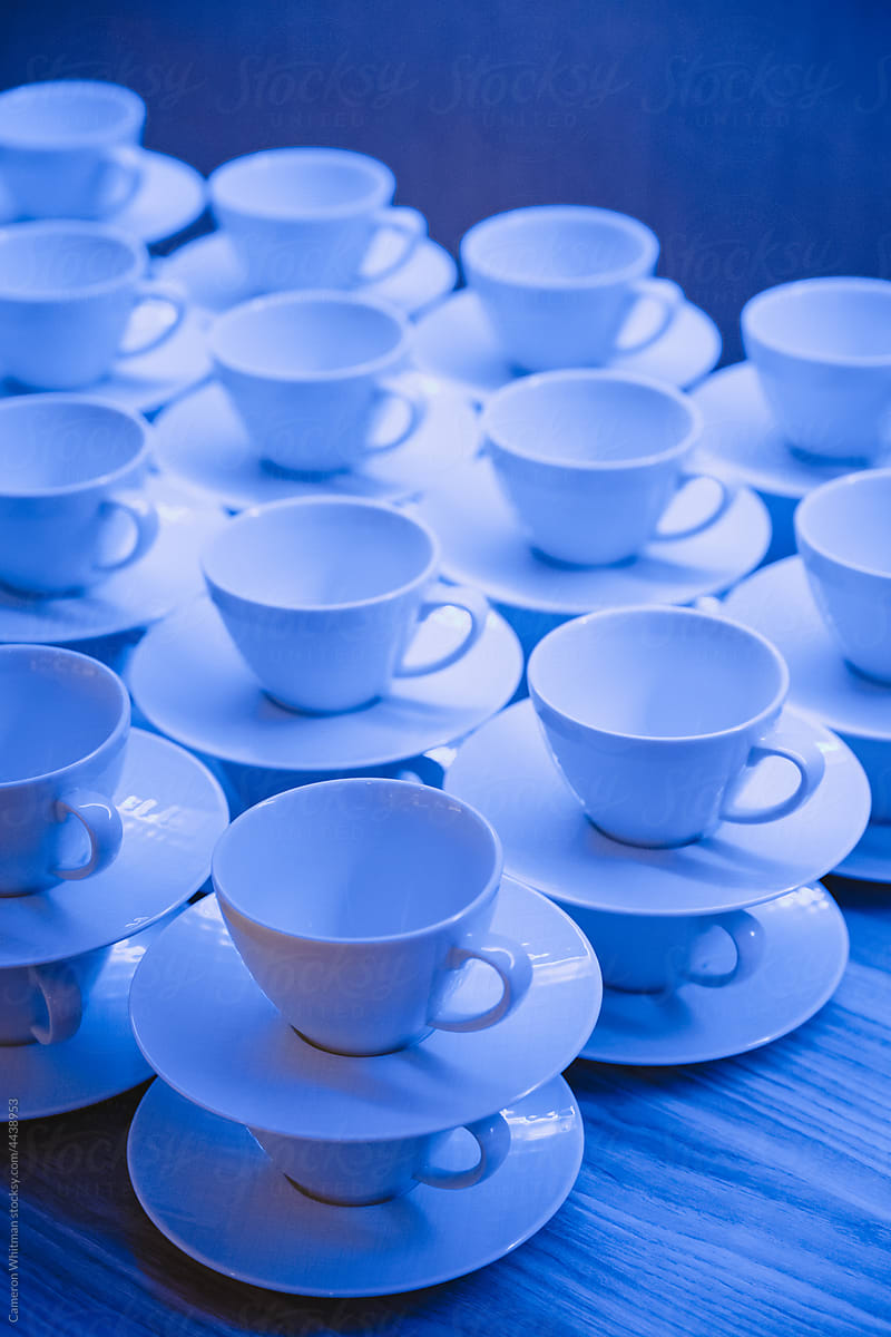 Stacked Coffee Mugs and Saucers