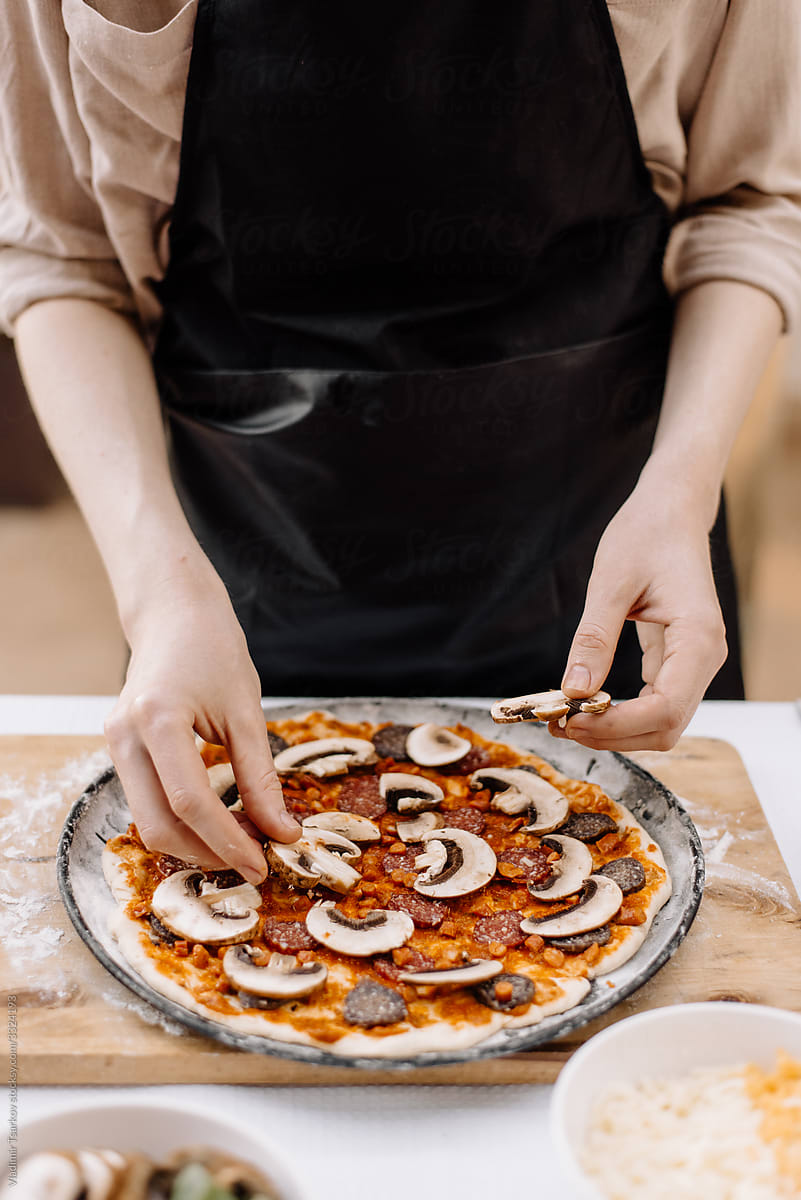 woman chef prepares pizza dough
