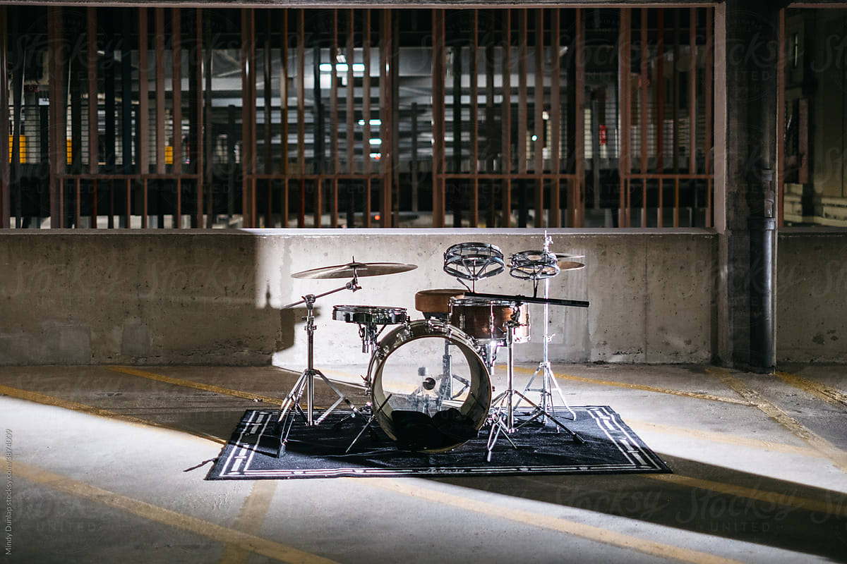 Drum kit set up in a parking garage