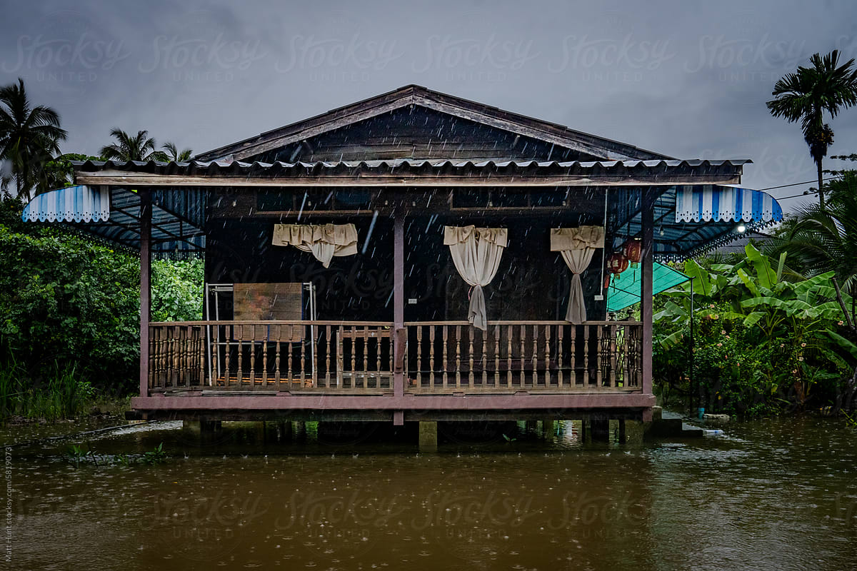 Abandoned wooden home is seen on the river during a flood in Thailand