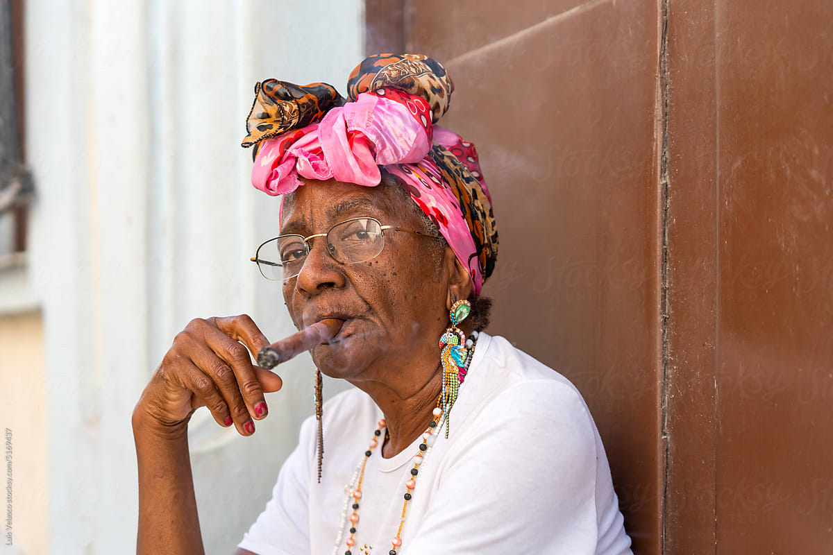 Portrait Of A Black Woman Smoking A Cigar In Cuba.