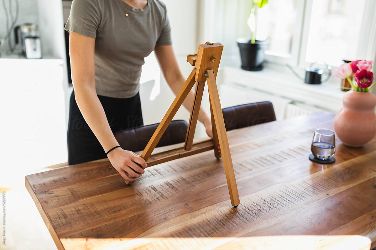 Unrecognizable person with easel