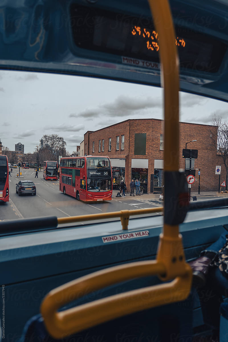 View from inside a bus in a United Kingdom neighborhood