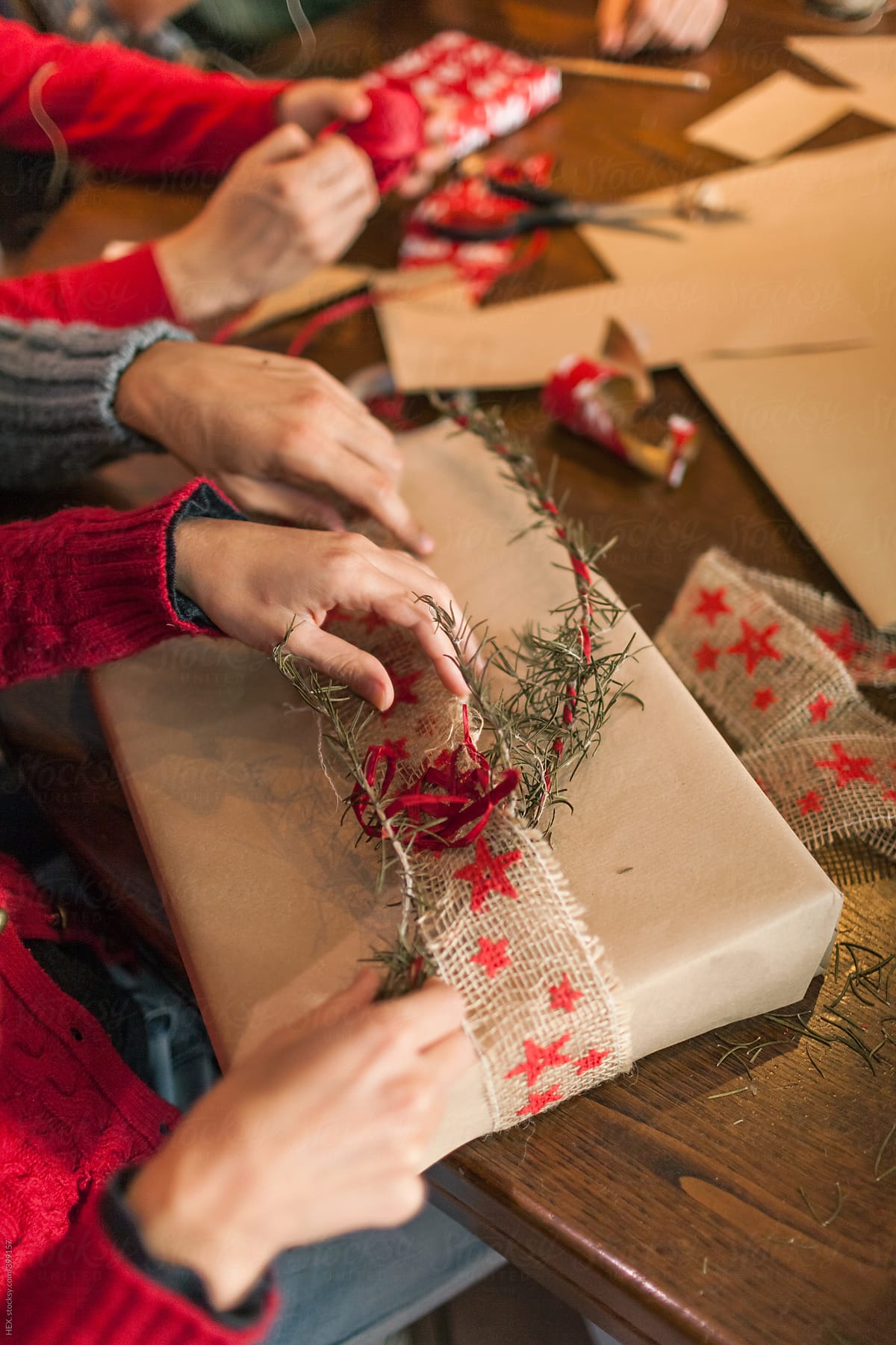 Friends Preparing Christmas Presents Over a Table