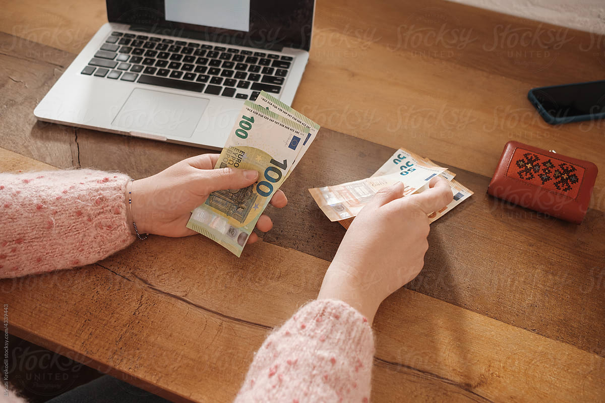 Anonymous Woman Counting Euro Bills In Cash