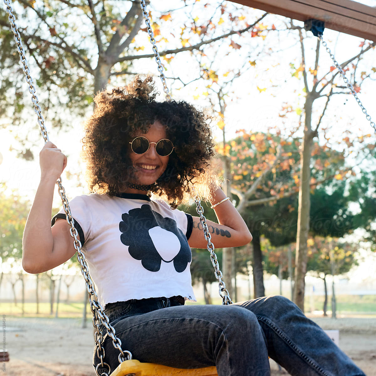 Smiling Curly Hair Woman On Playground By Stocksy Contributor Guille Faingold Stocksy 