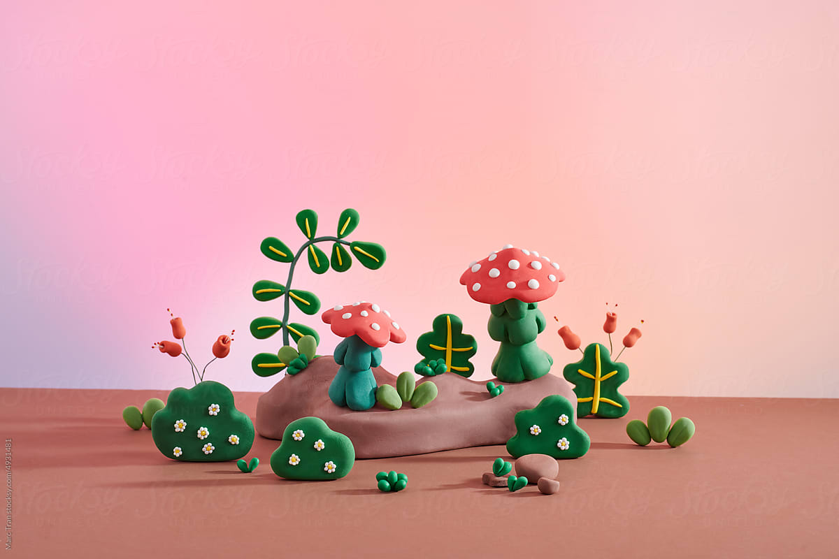 Set of garden bushes with fuchsia mushrooms made of plasticine
