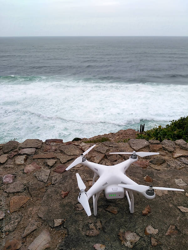 Drone at the edge of the cliff at the coast ready to fly