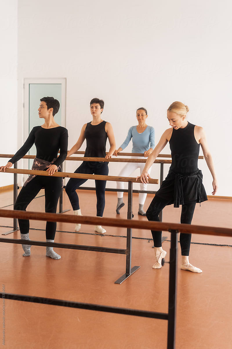 Ballet Teacher Working With Students