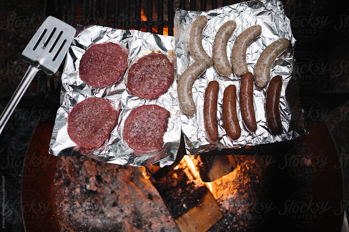 Meat cooking over a campfire