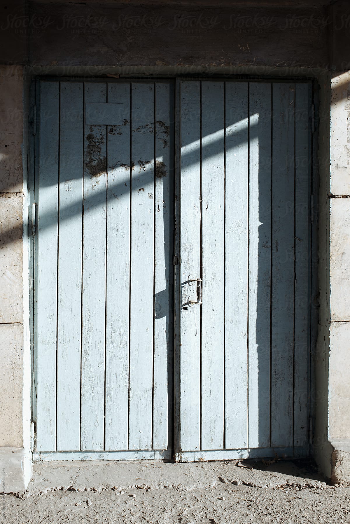 Front old doors illuminated by sunlight