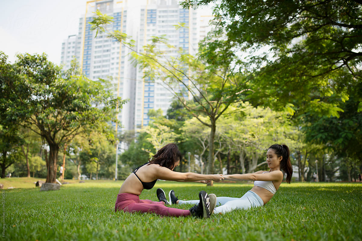 Two Singaporean friends are working out in the park