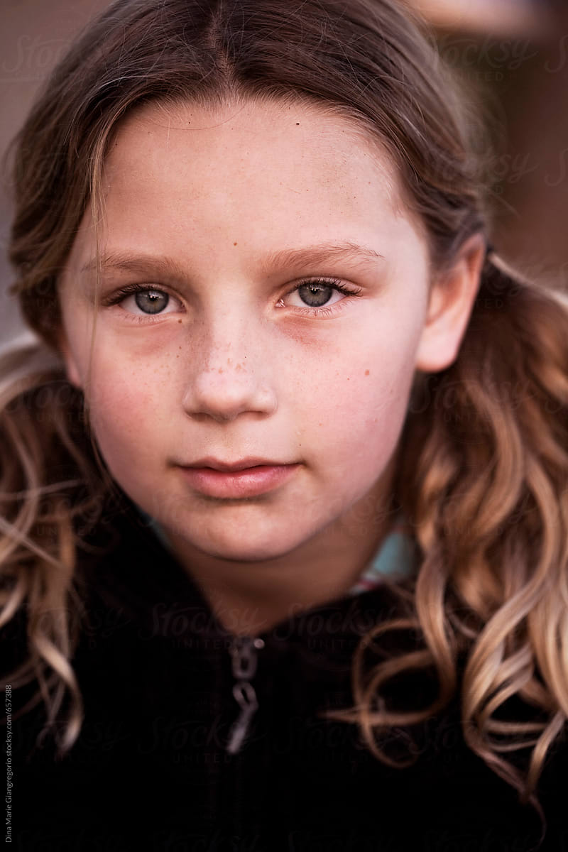 Young Girl With Pigtails and Freckles