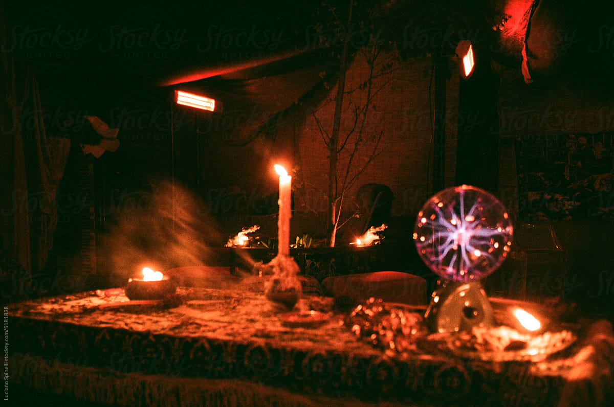 Lightning ball and twinkling candleы out of focus in the night