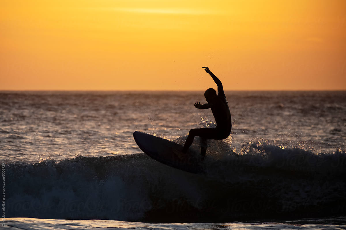 Surfing with a sunset