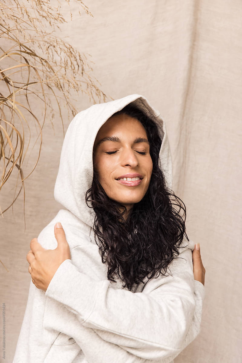 Woman in cozy white leisure set smiling