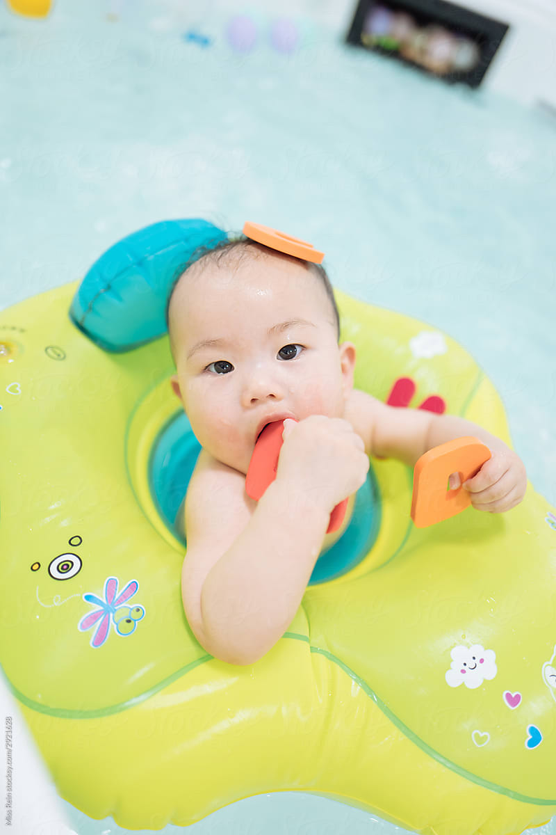 Baby wearing swimming ring