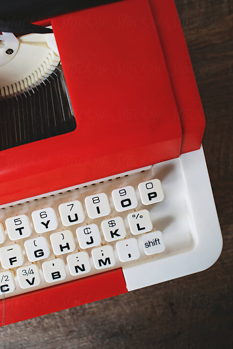 Bright red plastic vintage children\'s typewriter