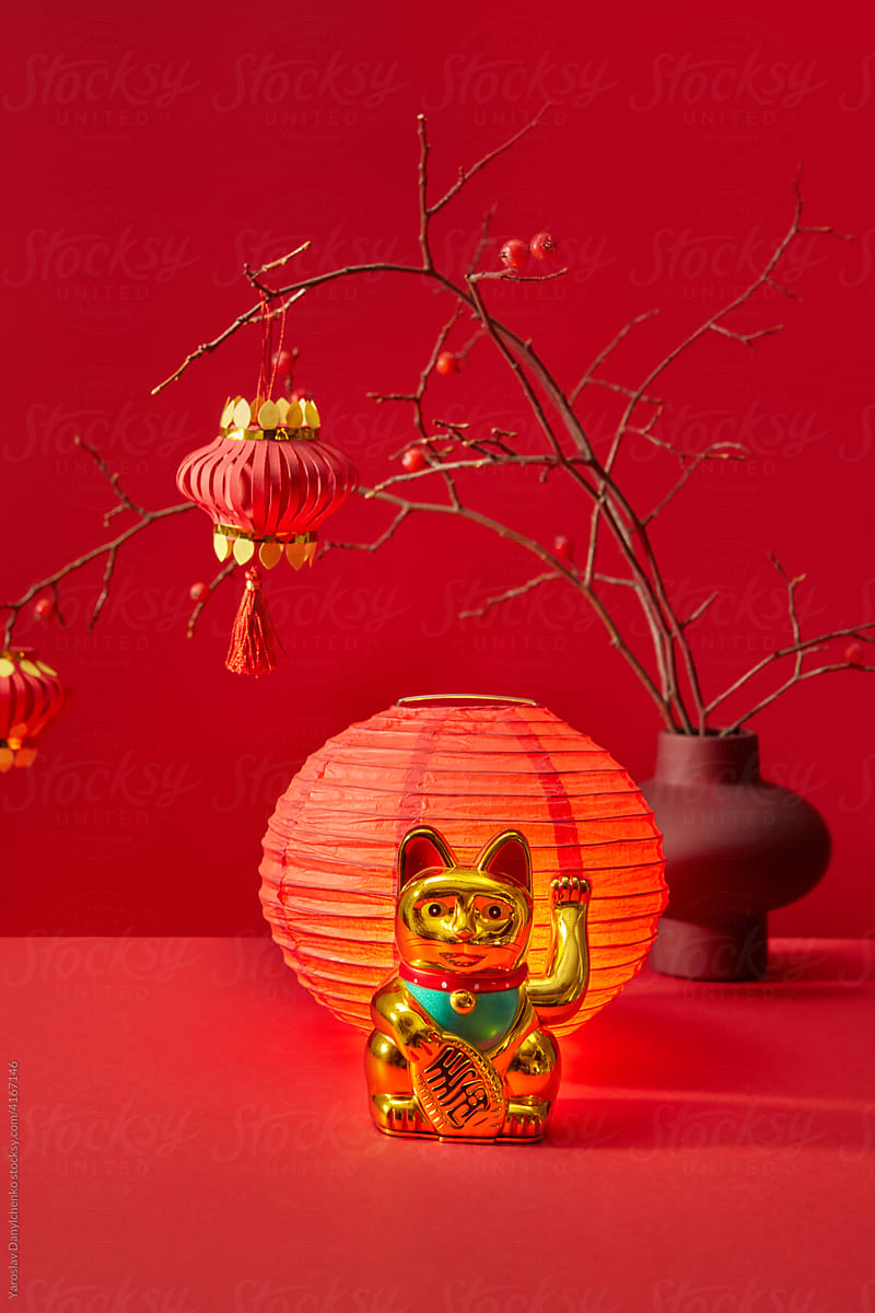 Chinese waving cat near lantern