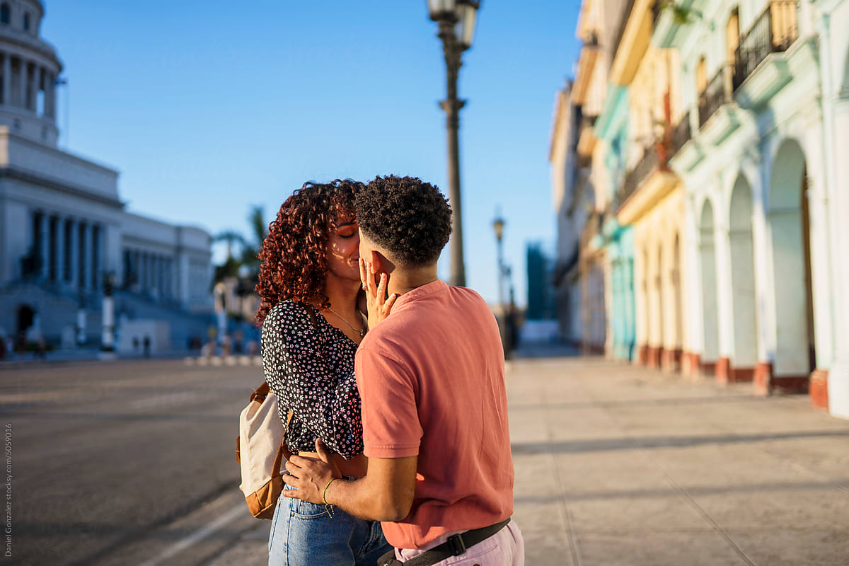 Cuban couple kissing during date