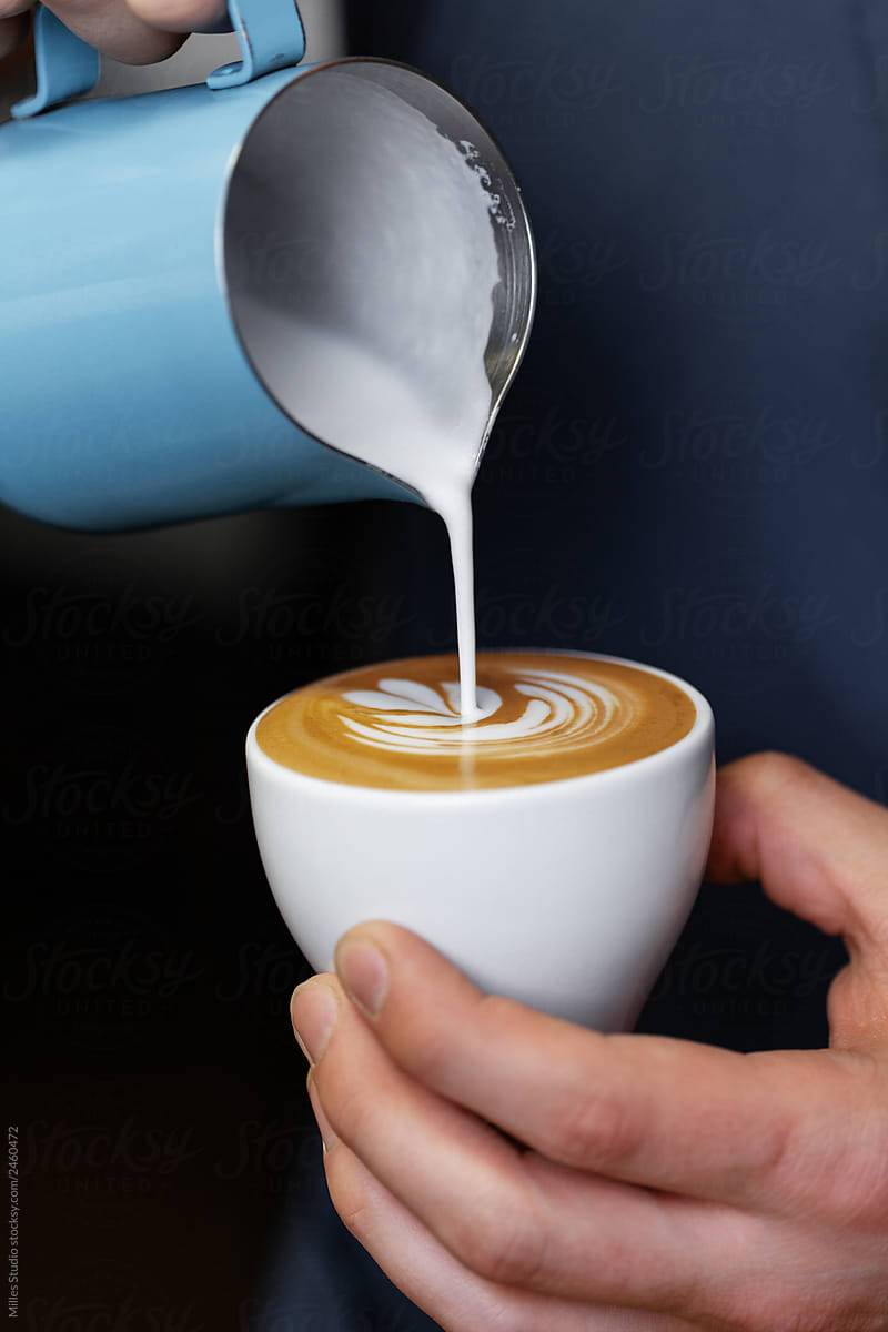 Barista making fresh latte