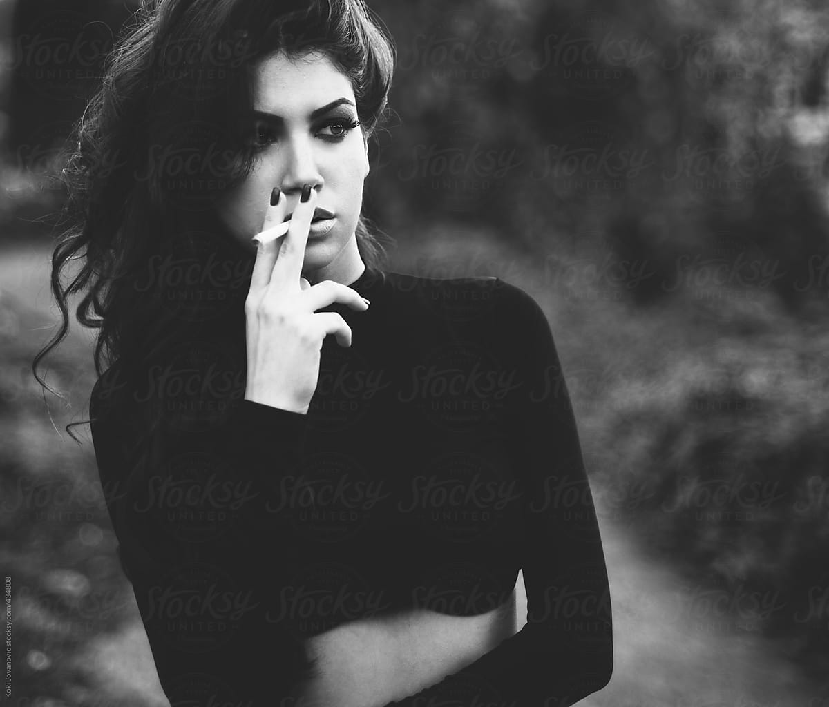 Beautiful Girl Smoking In Black And White By Koki Jovanovic Stocksy United