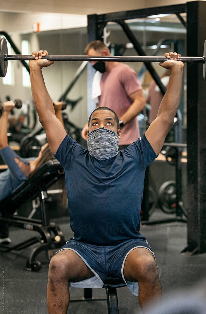 Gym: Man With Face Mask Lifting Barbell