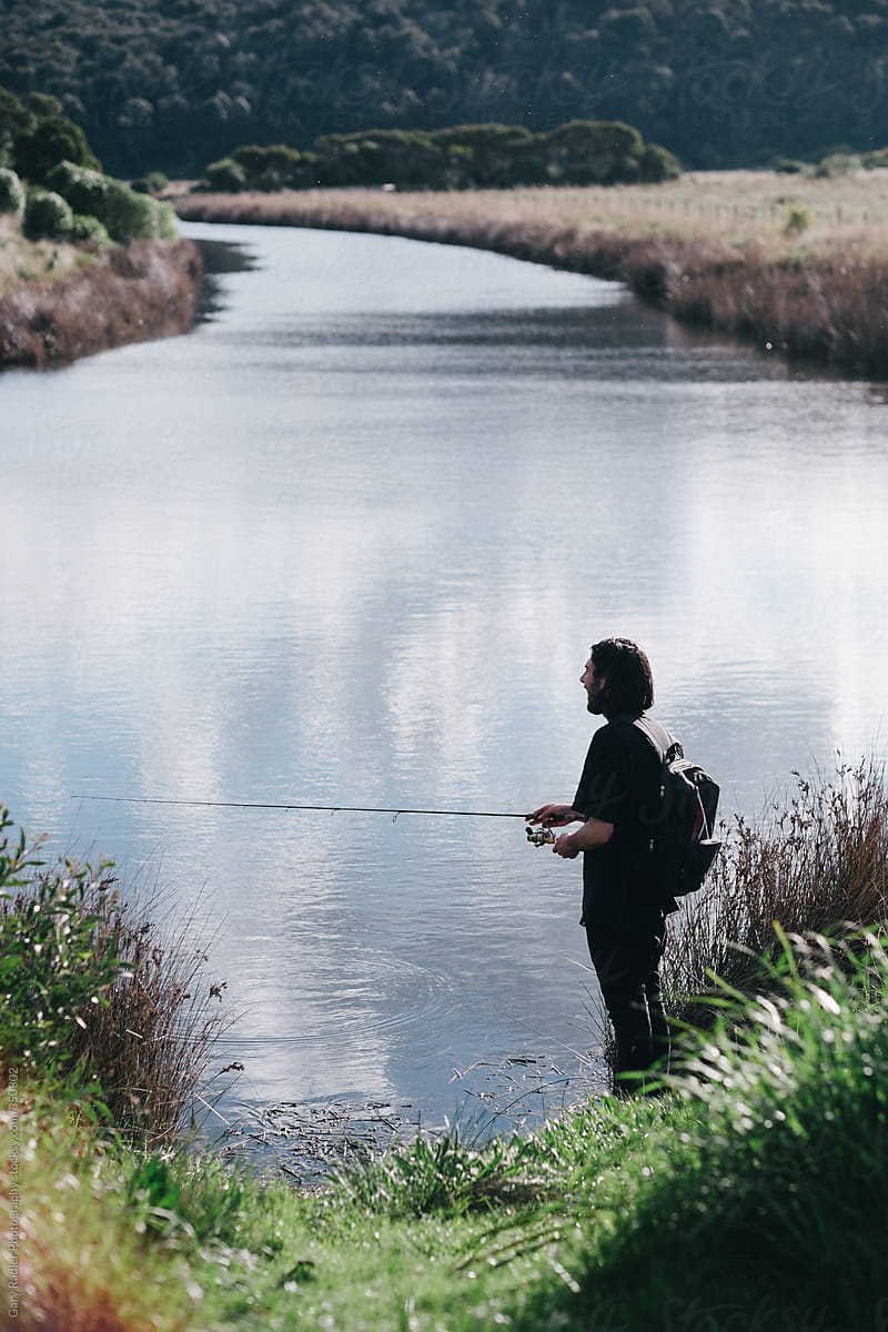 Bearded Fisherman on the Banks of a Creek