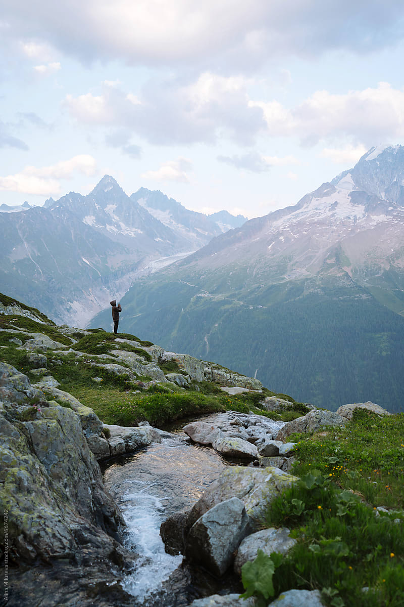 Unrecognizable Hiker Taking Photo Of Mountain Ridge