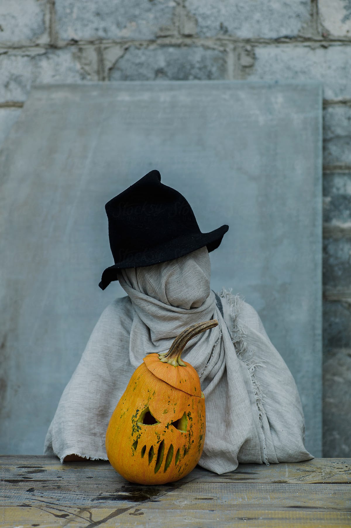 Mystic person with Halloween pumpkin