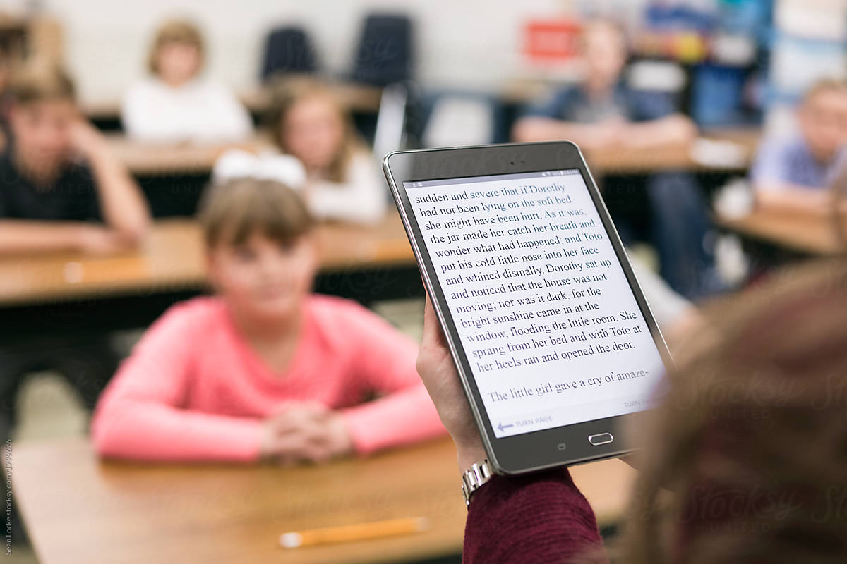 Classroom: Focus On Teacher Reading Digital Tablet