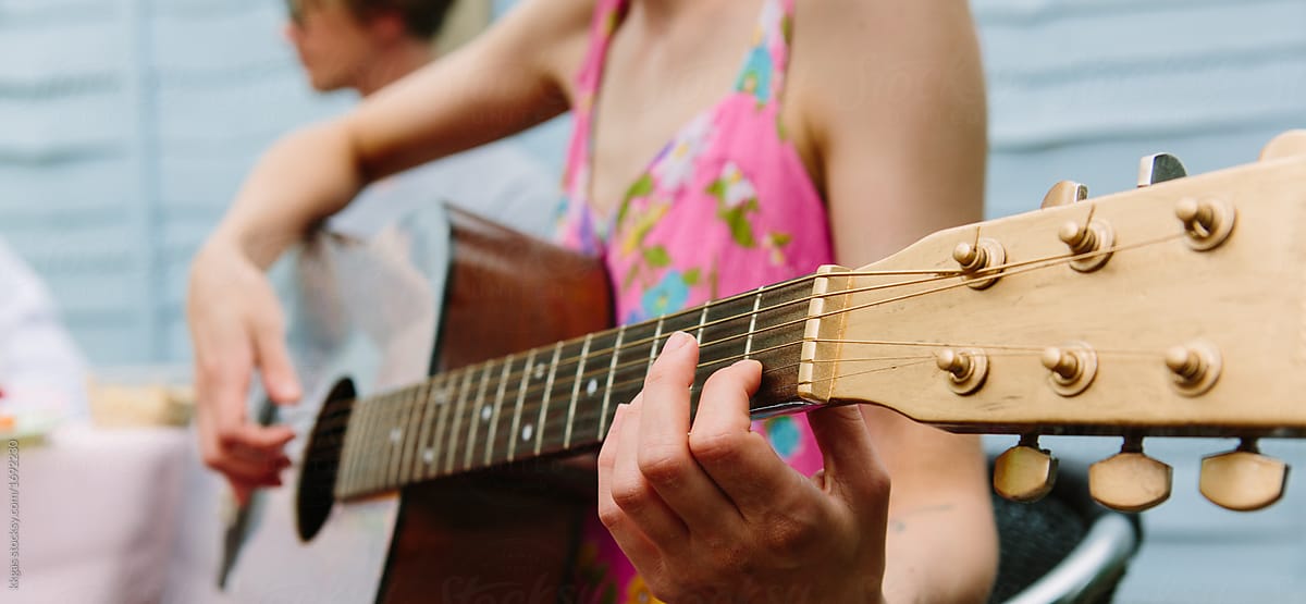 Anonymous woman playing guitar